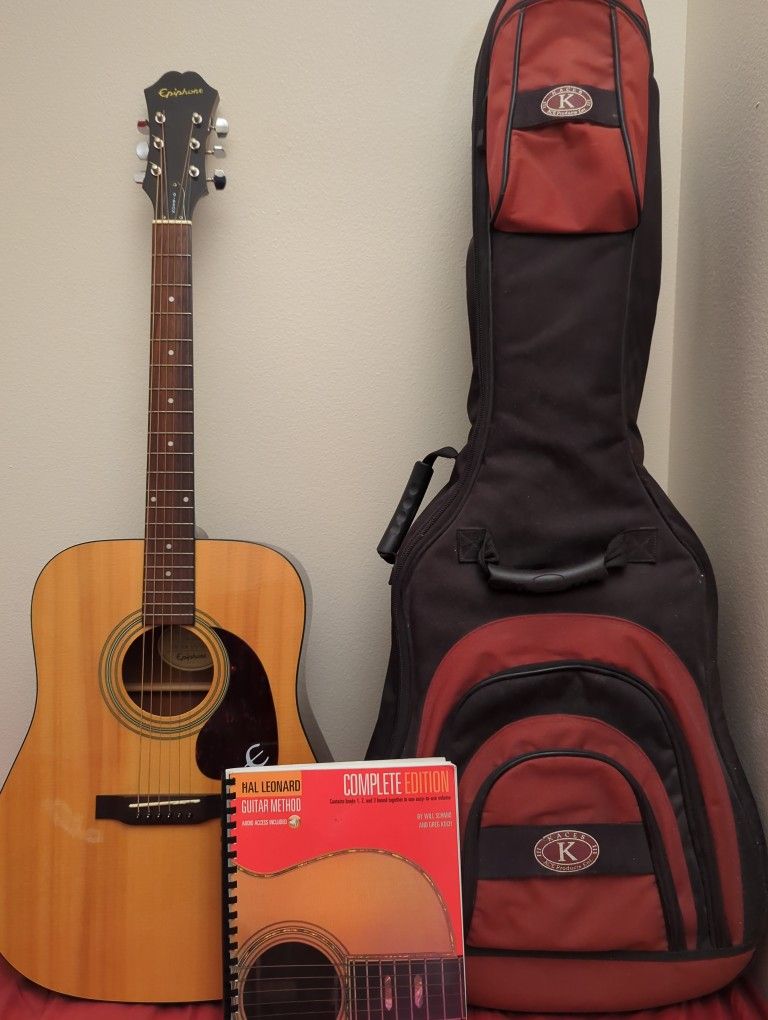 Title:
Epiphone Acoustic Guitar + Padded Case + Guitar Method Book – Great Condition