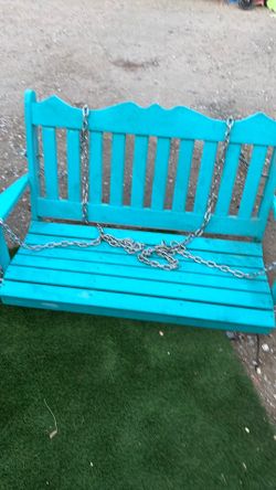 Patio swing 51 inches long by 18 inches wide and 25 inches high made up of composite wood strong