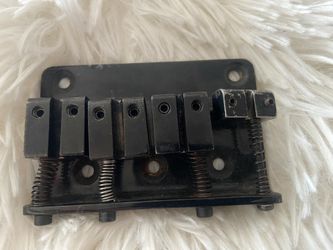 Four string bass guitar bridge