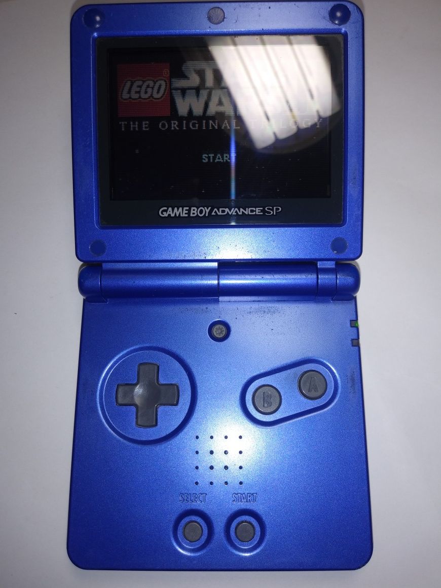 Cobalt blue gameboy advance sp in great condition + Star Wars 2 the original trilogy