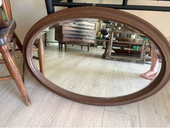 Vintage brown oval mirror