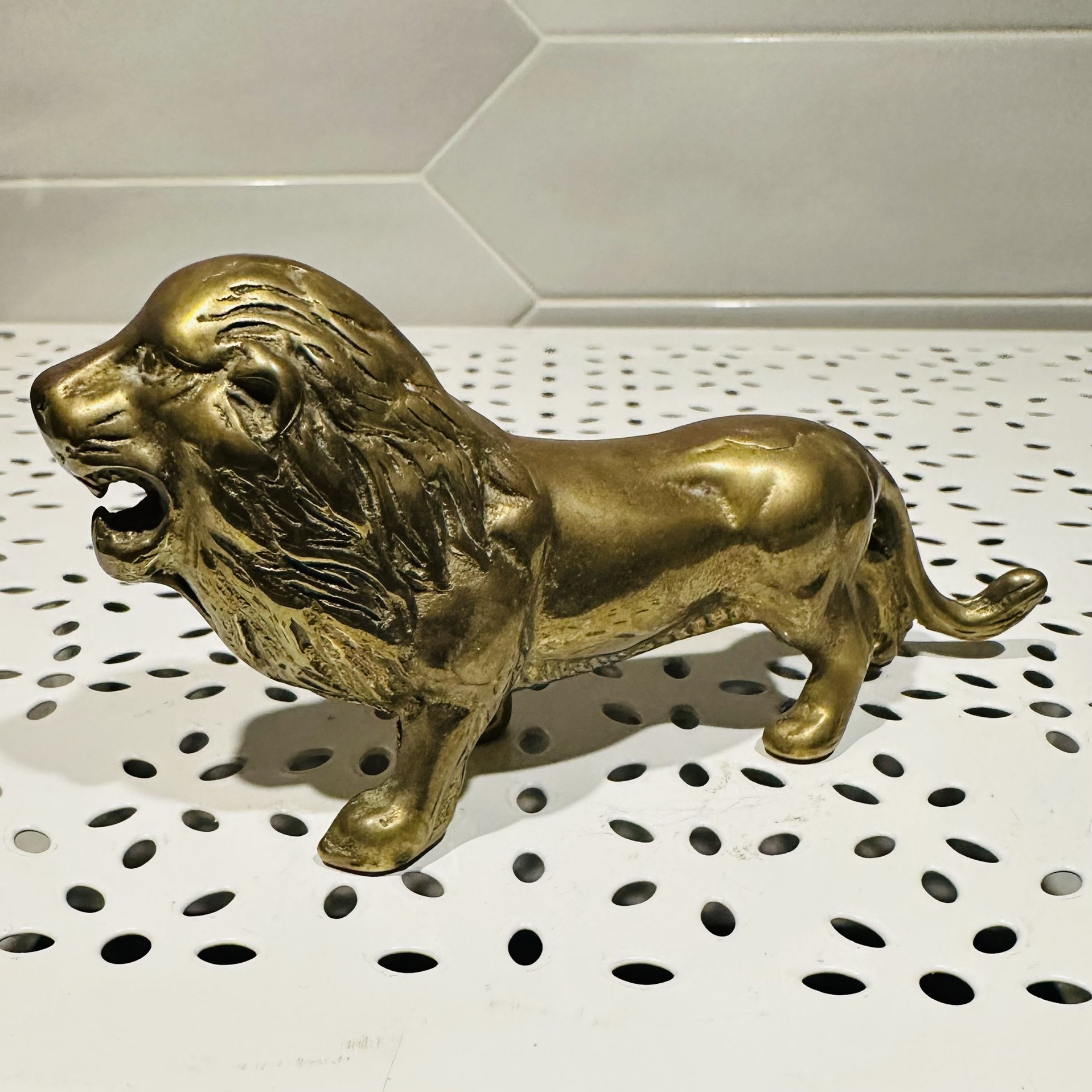 Vintage Taiwan solid brass lion figurine  5” long x 2 1/2” tall  Has normal vintage patina and has not been polished Has original foil sticker 