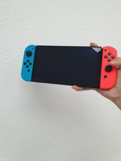 Nintendo Switch - OLED Model w/ Neon Red & Neon Blue Joy-Con (HEG-001) Good