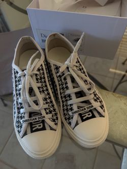 Women, Shoes, Sneakers Chic sneakers features black and white tones. Perfect for casual wear.