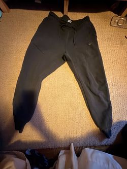 Black Nike tech pants