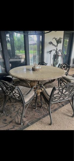 Large round granite table & iron chairs