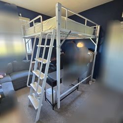 The Loft Queen metal bed includes an Ikea mattress