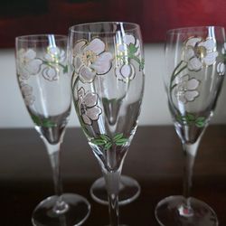 Set of four hand-painted crystal champagne flutes with floral decoration by Perrier-Jouët