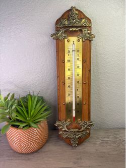 Vintage wood and brass thermometer