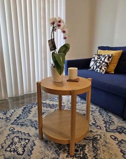 Round wooden side table
