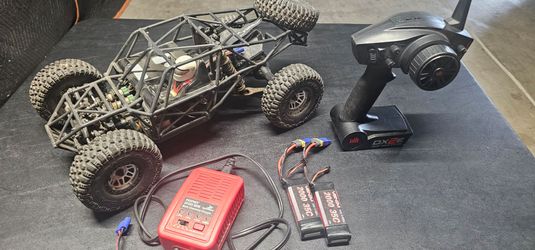 Vaterra twin hammers rc rock crawler with extras 2 batteries, upgraded battery charging system for different types of batteries