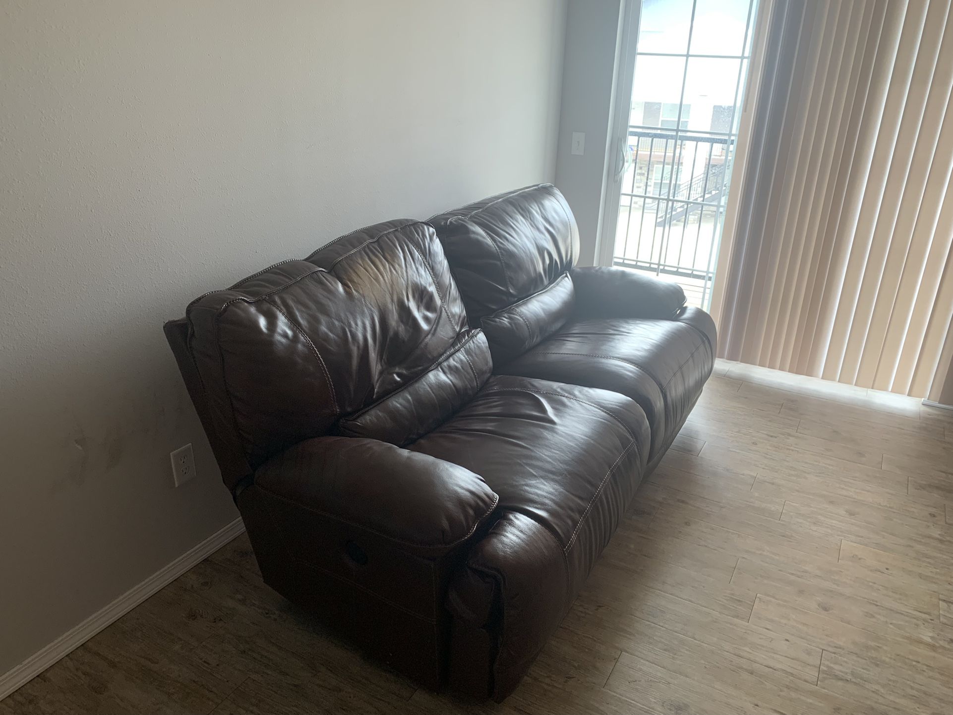 Ashley’s Furniture Wide Brown Authentic Leather W/ 1 Reclining Seat. Right Seat Power Reclines