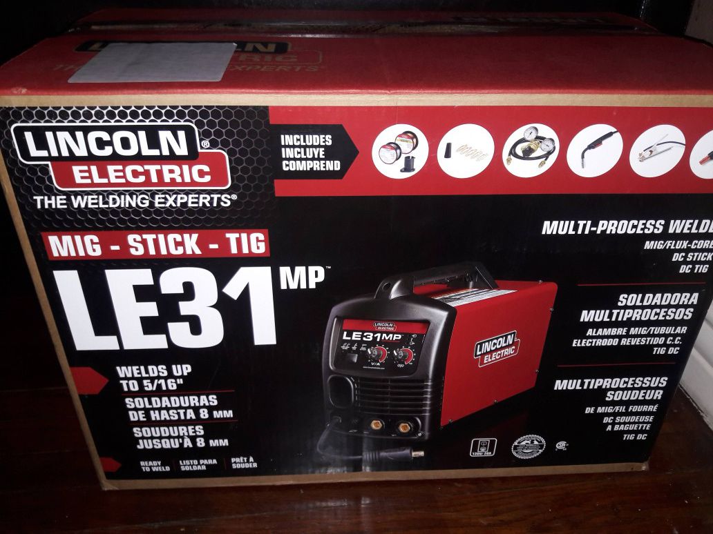 Lincoln Electric 140 Amp LE31MP Multi-Process Stick/MIG/TIG Welder with Magnum Pro 100L Gun, MIG and Flux-Cored Wire, Single Phase, 120V brand new