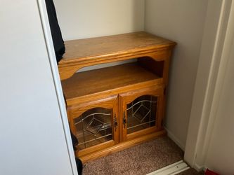 Wood stand table with glass doors and wheels