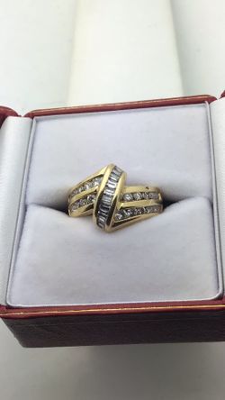 18k Yellow Gold Ring Channel Set Overpass Design Set a with Round and Natural Baguette Diamonds  Approximately 1 Carat total weight