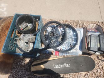 Free e- scooter parts . On curb.