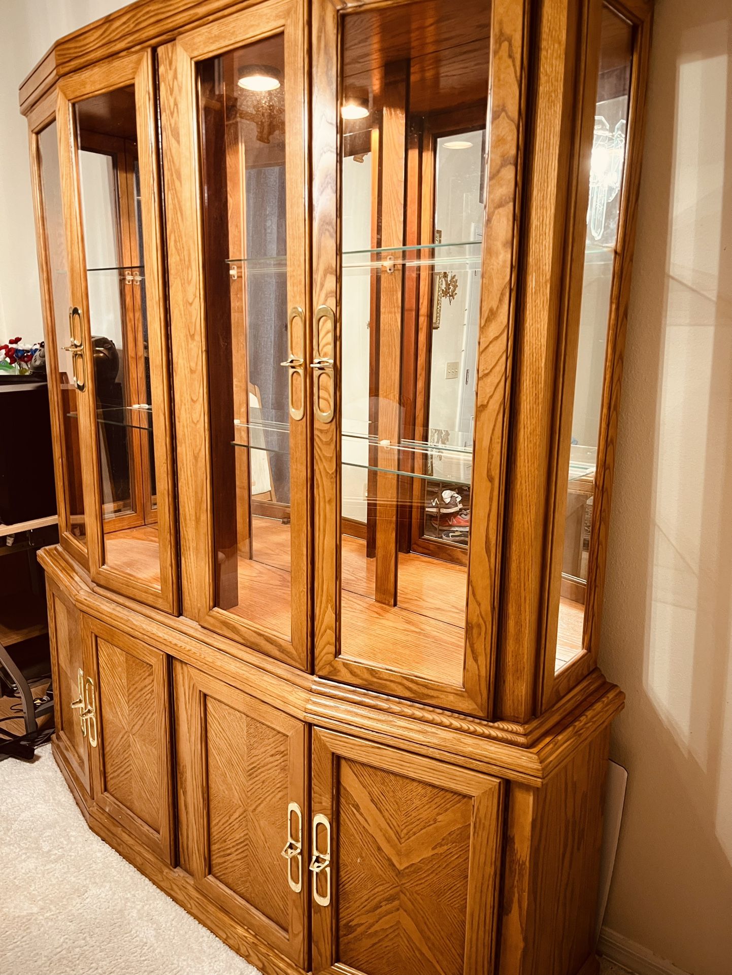 Lighted Large Oak China Cabinet by Arcese Brothers of Canada 2 pieces w/glass shelves. Matching Table and 4 chairs also available. Pickup in Tampa 336