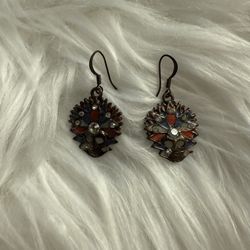 Dark-toned metal dangle earrings adorned with colorful enamel and clear rhinestones