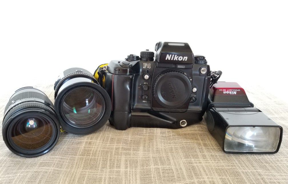 Nikkon F4 professional film camera with lenses