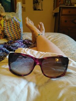 Dior Purple Sunglasses Front Is Tortoise Shell Purple And The Sides Are Straight Purple You Can See The Dior Label In The Glass.