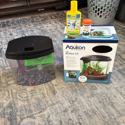 Fish Tank With Water Solution And Fish Food