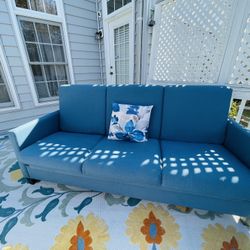 Comfortable Blue Futon/Sofa that Converts Into A Bed For Sale.