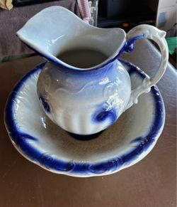 Antique blue and white ceramic pitcher and basin set