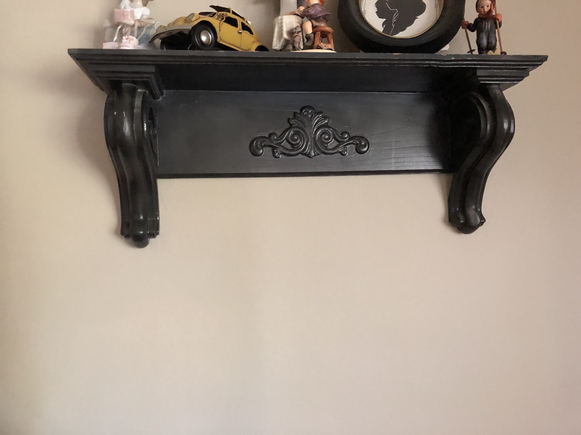 Two black wall shelves