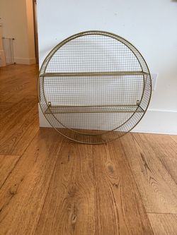 Round gold metal shelf