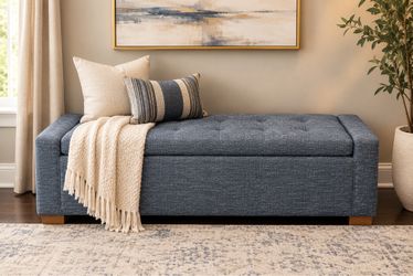 blue-gray upholstered storage bench with lift-top storage