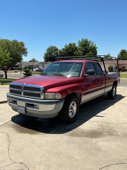1998 Dodge PU, 5.9L  Laramie SLT. Long Bed, 194K Miles, Registered, Clean Pink,  Farm truck, new catalytic converter, runs fantastic.