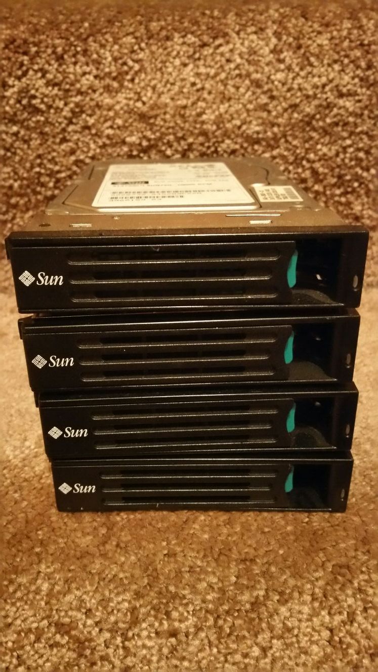 4 Sun Fire Hard drives with server mounts (computer)