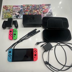 nintendo switch with some extra things 