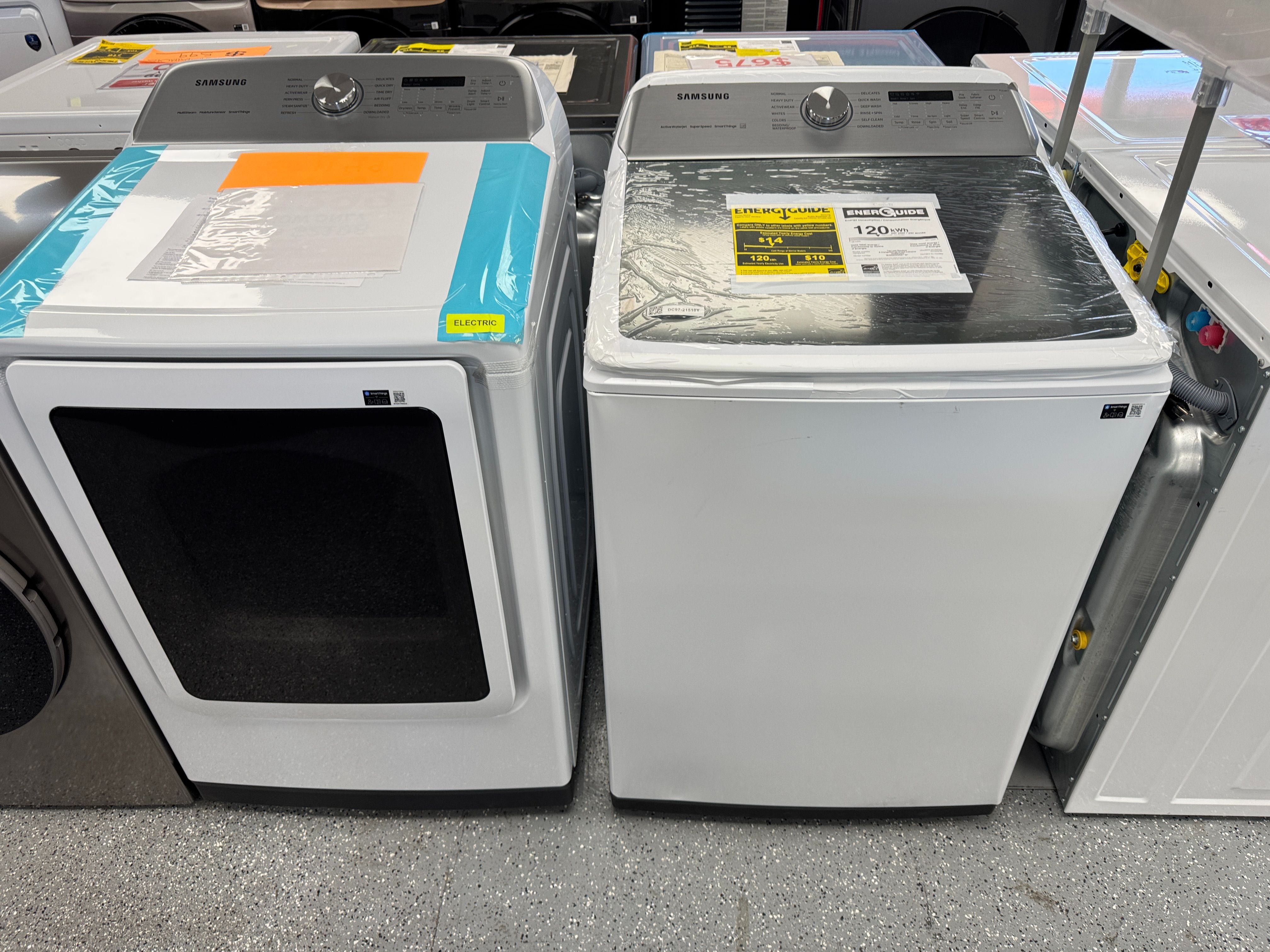 White Samsung Washer 5.2 cu ft and 7.4 cu ft Electric Dryer Set. Units are new open box scratch and dent