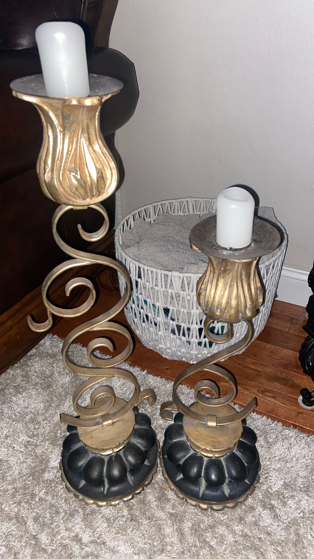 This is a pair of antique brass heavy metal chunky candle holders with a unique swirl design