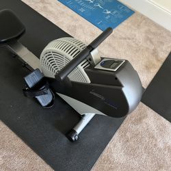 Rowing Machine And Floor Matt