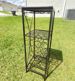 Selling a wine rack for 18 bottles + glasses.
