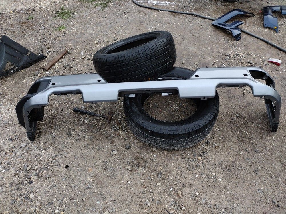 2019 To 2022 Chevy Or GMC Rear Bumper Gray In Color With Sensor Holes Top Plastic And One Step OEM Parts