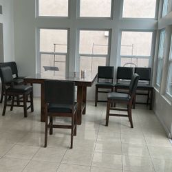 Dining table and eight dining chairs