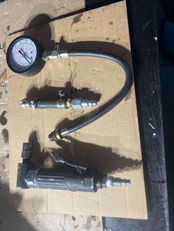 Tire pressure gauge & cutting tool