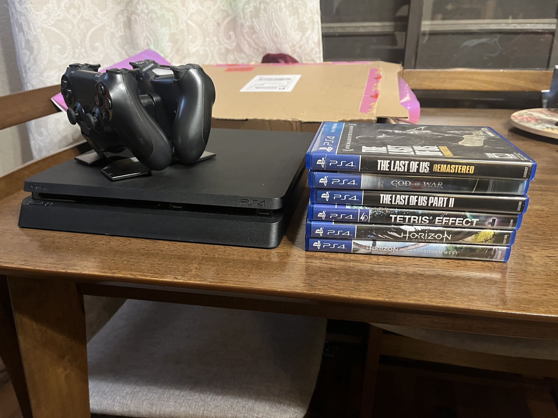 PS4 Slim 1TB/Two (2) Controllers + Charging Dock/Six (6) Games