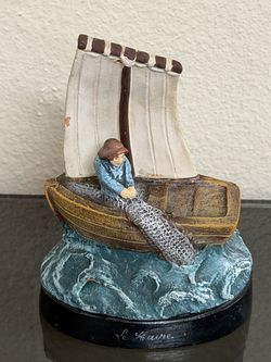 A Ceramique I.A. D'Art figurine from  France,  a French nautical theme of fishermen and boats.