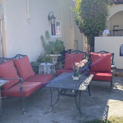Gorgeous patio set excellent condition very clean and comfortable aluminum frame everything includes 8 cushions 2 chairs  1 bench and center table