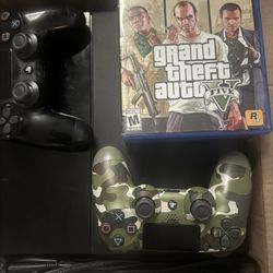 PS4 with power cable, 2 official PS controllers, GTA 5 and 3 other games.