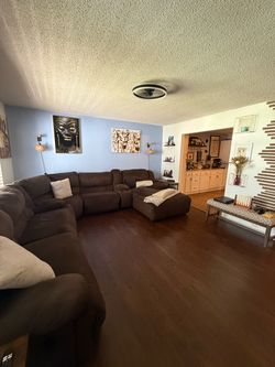 Chocolate sectional w/ 2 recliners & Chaise