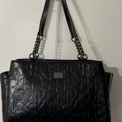 Calvin Klein tote bag with an allover embossed logo pattern and chain