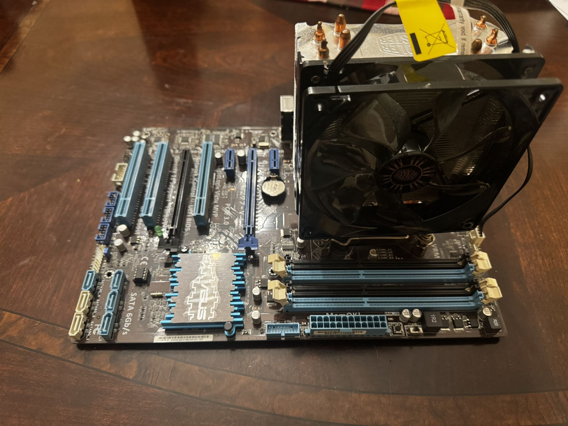 Asus Motherboard + Intel (R) Core (TM) i5-2500k CPU + Cool Master Cooling Fan