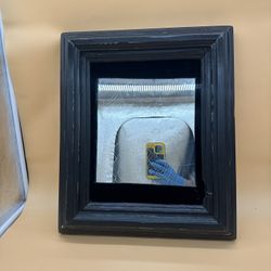 antique mirror in a brutal wooden frame and glass with a spider web engraving