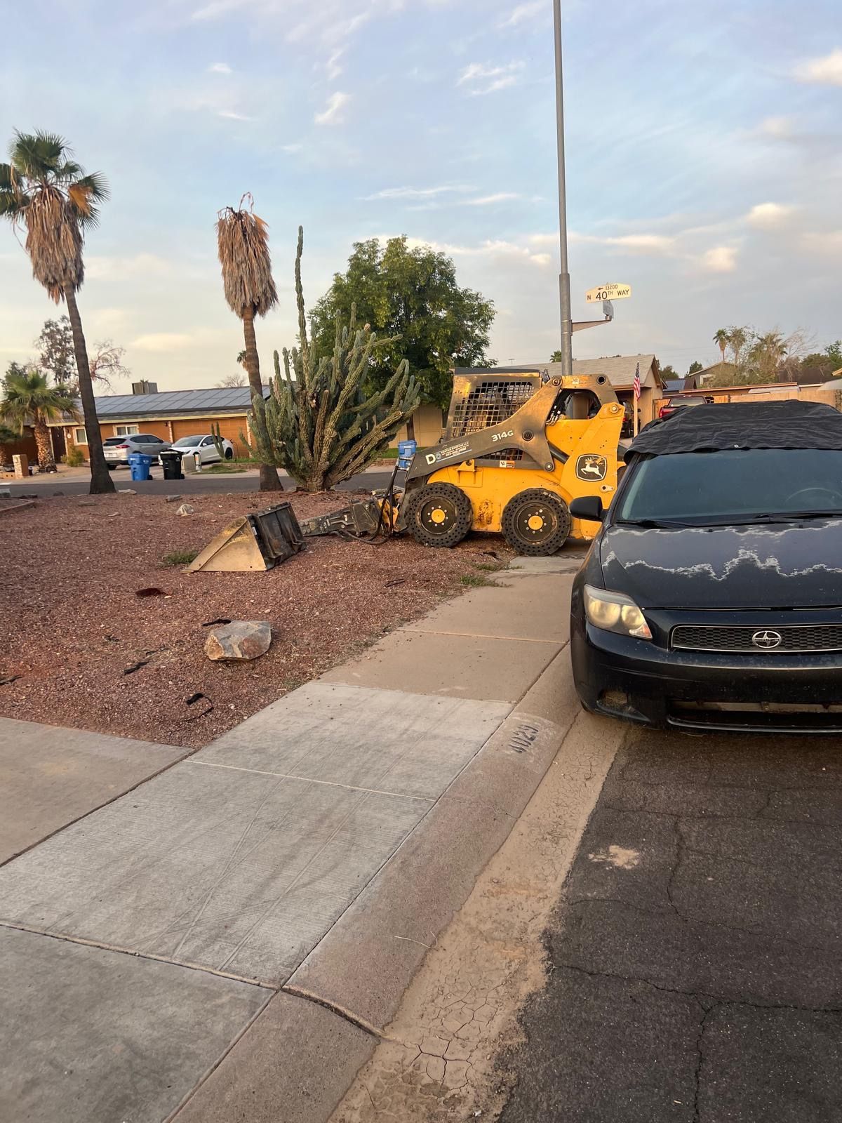 Skid Steer John Deere 314G And Jackhammer