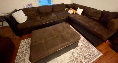 Large brown microfiber sectional sofa with ottoman and armchair